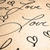 A static image of a light beige background with repeated dark brown cursive text reading 'Love' and heart symbols, arranged in a scattered pattern.