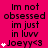 A static image with a bright pink background displays repeated text and heart symbols in black and white.