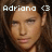 A pixelated image of a person with long brown hair, showing text overlays that change across frames.
