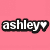 Pixelated text 'ashley' in white with black outline on pink background, ending with a heart symbol replacing the final letter.