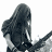 A 48x48 pixel animated buddy icon featuring a grayscale figure with long hair on the left and green text "Original Icons .com" on a dark green background on the right, displayed as two sampled frames in a contact sheet layout.