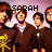 Pixelated image of people in dark brown robes with yellow symbols, overlaid text reading 'SARAH LOVES ALL TIME LON' on a light purple background.