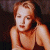 A pixelated image of a person with light brown hair lying on a dark surface, next to green text reading 'Original Icons .com' in bright neon style.