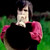 Pixelated static image of a person with dark hair wearing a black top and pink shoulder accents against a green background.