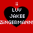 Red background with four black heart shapes, each containing white text "LUV JAKEE" and two vertical white lines above the hearts, with a repeating white pixelated text banner across the middle.