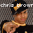 A pixelated image of a person wearing a black cap with yellow text, pointing forward in three showing slight head movement