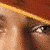 A 2x2 contact sheet of sampled frames from an animated icon showing a person wearing a red cap with gold trim and white accents, displaying facial expressions and pose changes across three visible animation frames.
