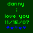 Green pixelated text on dark green background with blue star symbols, showing 'danny i love you 11/15/07' and animated star positions.