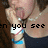 A person with brown hair and a dark top holds their hand near their face, showing text overlays that change across frames.