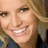 A pixelated image of a smiling person with blonde hair on a red background, with text elements 'UR', '50', and 'HOT' in black pixelated font.