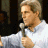 A pixelated contact sheet showing two frames of an animated icon featuring a person holding a microphone on the left and green text reading "Original Icons .com" on the right against a dark background.