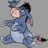 Pixelated blue cartoon character with black ears and tail, light pink face, white belly, arms outstretched against gray background.