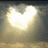 A static image with a red background, featuring pixelated text and a heart-shaped light effect in the upper left.
