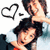 Two pixelated figures with dark hair, one holding a heart-shaped speech bubble above the other's head against a white background.