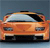 Pixelated orange car with black roof and blue headlights, viewed from front against dark blue background.