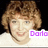 Pixelated image of a person with light brown curly hair wearing a white top, with purple text reading 'Dorla' in the bottom right corner.