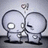Two stylized figures with large circular heads and simple limbs stand side-by-side against a light gray background.