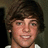 Pixelated portrait of a person with brown hair on left, bright blue background with pink text 'I LOVE RYAN' on right.