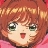 Pixelated close-up of a character with short brown hair, green eyes, and a red tongue sticking out against a pink background.