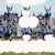 Group of people in blue and gray uniforms on a grassy field with white clouds, text overlays change from 'fun!!' to 'omg'.