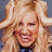 Pixelated image of a smiling person with long blonde hair on a bright pink background with black text.
