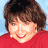 A static image shows a person with short brown hair wearing a red top against a light blue background, next to green text on dark green.