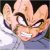 Pixelated close-up of a character's face with wide eyes, raised eyebrows, and an open mouth showing teeth.