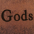 Brown pixelated background with black text reading 'Gods' in a serif font.