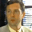A 48x48 pixel buddy icon split into two frames showing a person on the left and green text on a dark background on the right, with visible pixelation and dithering effects.