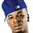Pixelated image of a person wearing a blue beret with a white circular emblem, brown hair, and a neutral expression against a white background.