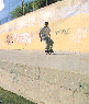 A sequence of showing a person performing skateboard tricks at an outdoor skatepark with concrete ramps and graffiti-covered walls