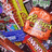 Pixelated image of a colorful candy with green and blue accents on yellow background, surrounded by repeated 'Candy' text in black font.