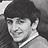 Black-and-white pixelated portrait of a person with short dark hair and light skin, rendered in low-resolution grayscale with visible dithering and anti-aliasing effects.