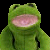 Green frog-like figure with open mouth against black background, pixelated text reads 'My froggy doesnt like you' in white block letters.
