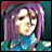 Pixelated character with purple hair and teal clothing, static pose with text overlays changing across frames.