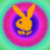 Pixelated static icon featuring a yellow rabbit-like mascot against a rainbow gradient background with concentric color rings.