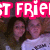 Two people pose together under large pink text reading "BEST FRIEND" with white outlines, set against a dark background.