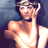 Static 48x48 pixel icon of a person with dark hair wearing a white sleeveless top and headband, set against a gradient background.
