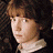 A pixelated image shows a person with brown hair and a white collar, surrounded by repeated pink text reading 'i love' and 'Liam Aiken', with small heart symbols below some text lines.