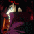 Animated sequence of a character in purple cloak with red hair, showing head movement and background light changes.