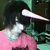 A person with a unicorn horn on their head wears a pink shirt and has dark hair, shown in two states: one without text overlay and another with 'i'm a unicorn! wee!!' text.