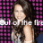 A pixelated image of a person with long dark hair against a pink and black checkered background, overlaid with partially obscured white text.