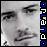 Pixelated grayscale face with closed eyes and mouth, vertical blue-and-white text on right edge.