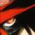 A pixelated image split into two sections: a red-hatted figure on the left and a black-and-white circular emblem with intricate patterns on the right.