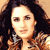 Static pixelated image of a person with dark hair and light skin wearing a patterned top, displayed as a 50x50 buddy icon on a beige background.