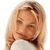 Static 50x50 pixel icon showing a close-up of a person with light brown hair and fair skin, wearing a white top with dark collar detail, against transparent background.