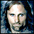 Pixelated image of a person with long dark hair against blue background, next to yellow text reading "LORD OF THE RINGS THE TWO TOWERS" on black.