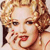 Pixelated close-up of a person with curly blonde hair, red lips, and a hand near the face, set against a light background.