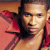 Pixelated image of a person in red clothing with pink text reading "Usher's Babi*" on black background, displayed as left frame of 2-frame contact sheet.