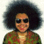 A split-frame contact sheet showing a pixelated person with an afro hairstyle on the left and green text reading "Original Icons .com" on a dark green background on the right.